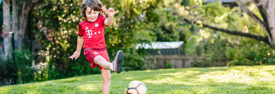 A child having fun playing soccer