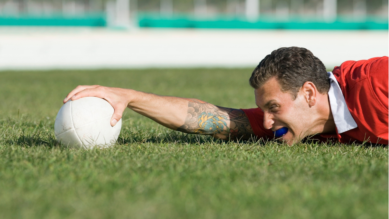 A rugby player is seen here wearing his mouthguard to make sure he is protected during any bumps, knocks and tackles.