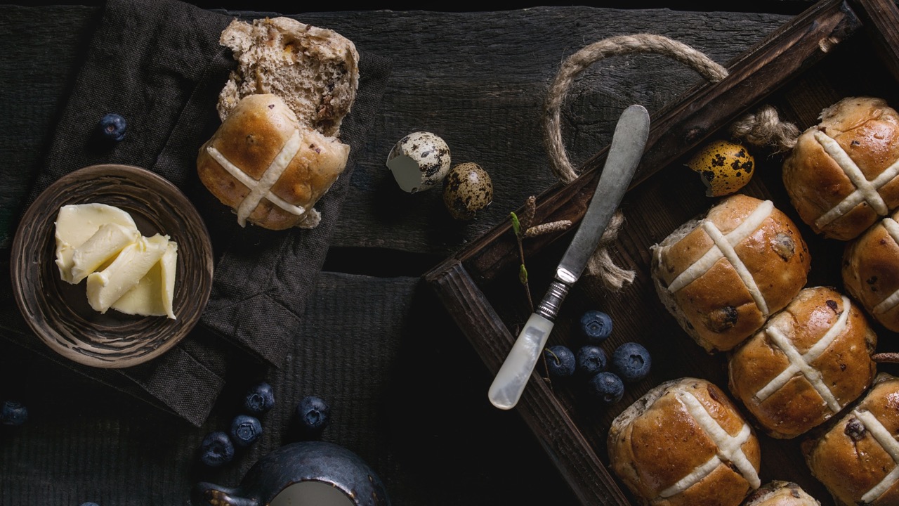 Rustic hot cross buns with melted butter