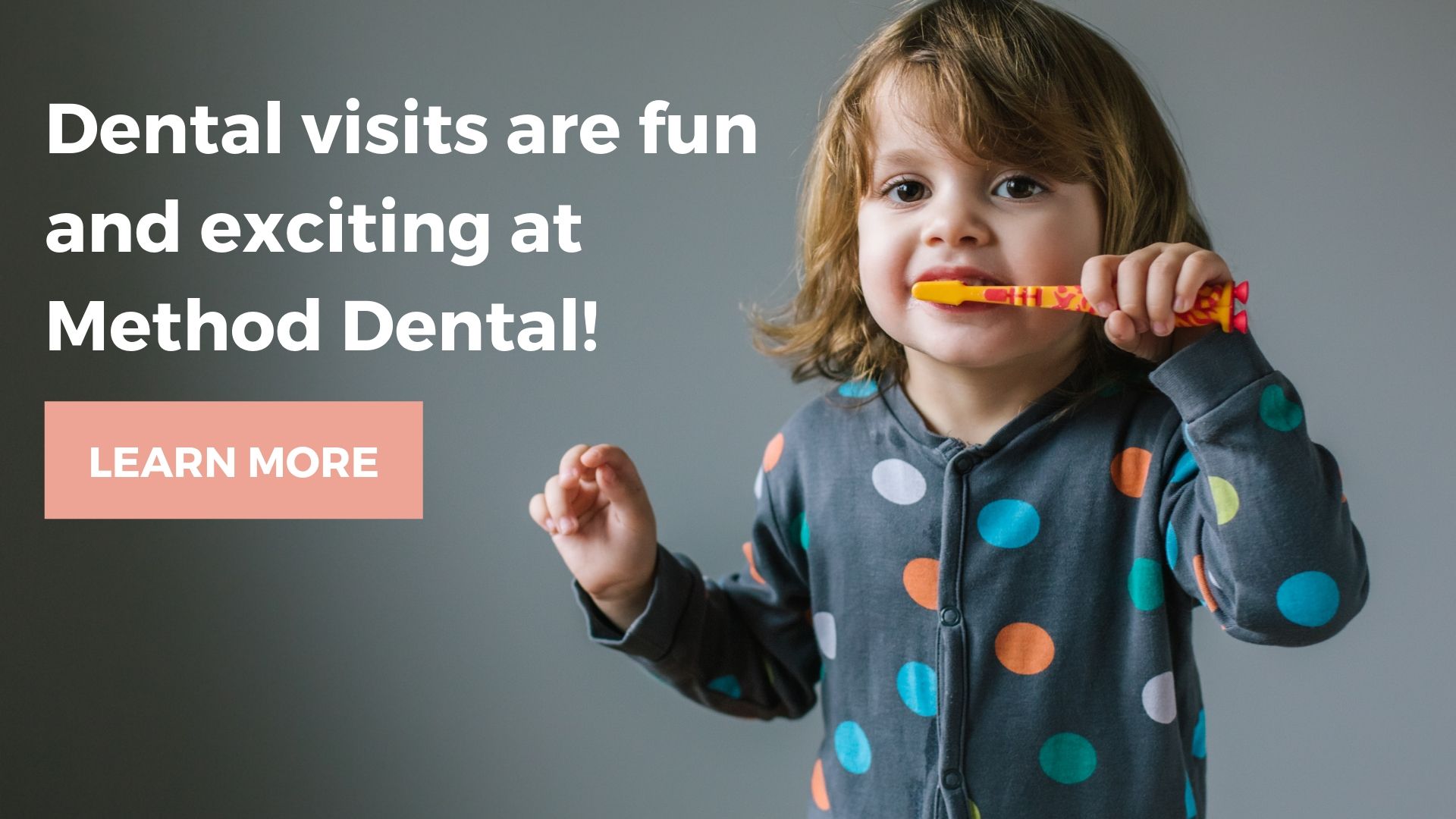 A child brushing their teeth in their pyjamas