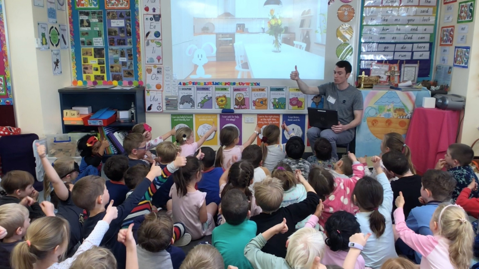 Kids paying attention to Dr. Grant talking about Carrots and oral health at St. Columba's